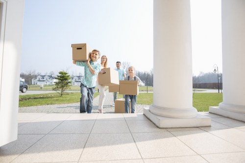 Mover wearing PPE using equipment to transport items safely