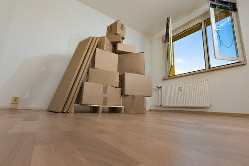 Packed household boxes ready for a local move in Mill Hill