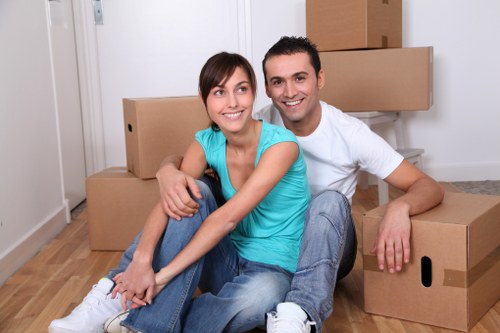 Local movers handling furniture during a house move in Mill Hill