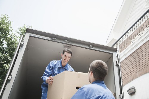 Furniture and boxes being transported by moving van in Mill Hill