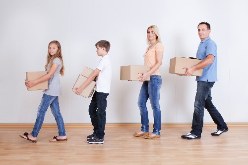 Removal team loading furniture and boxes for a local house move